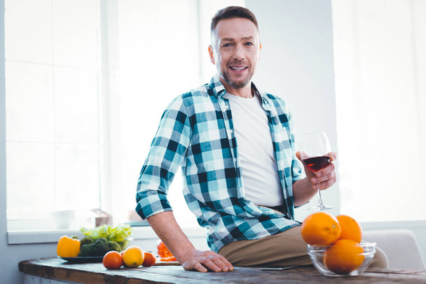 Positive handsome man being addicted to wine - Photo, image