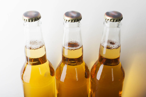 Beer in bottle on background,close up - Фото, зображення