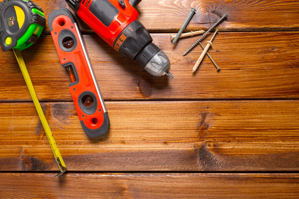 Different work tools on wood background - Foto, immagini