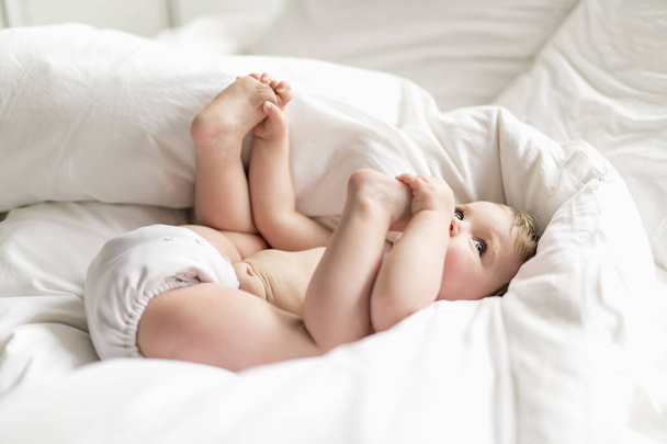 one years girl baby on the bed - Foto, imagen