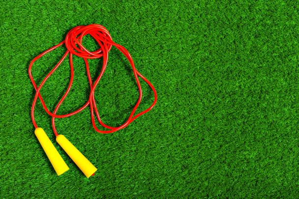 Jump ropes on grass. - Zdjęcie, obraz