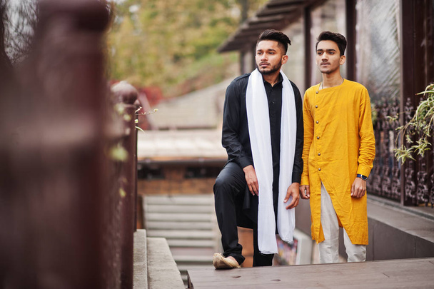 Two indian stylish mans friends in traditional clothes posed outdoor. - Foto, Imagen