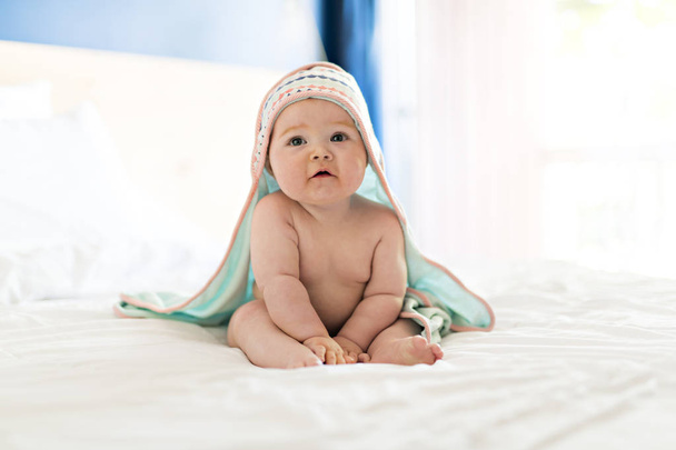 beautiful baby girl in the bed at home with - Fotoğraf, Görsel