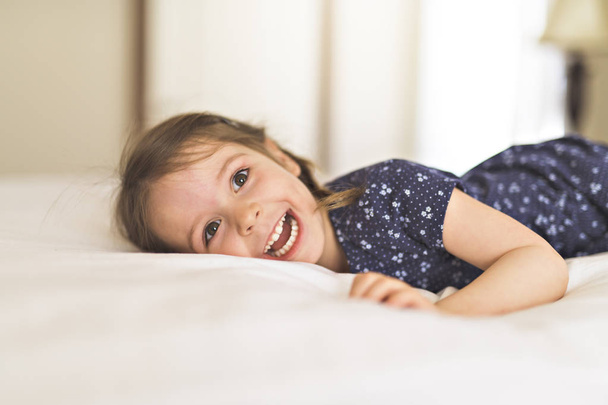 A cute Little beautiful girl on bedroom - Foto, Imagem