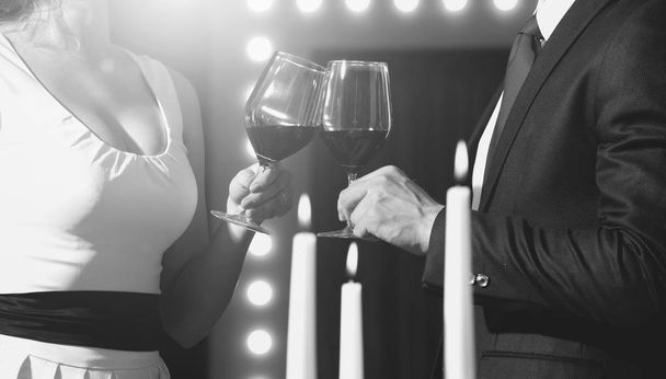 toast of couple clink glasses with red wine - 写真・画像