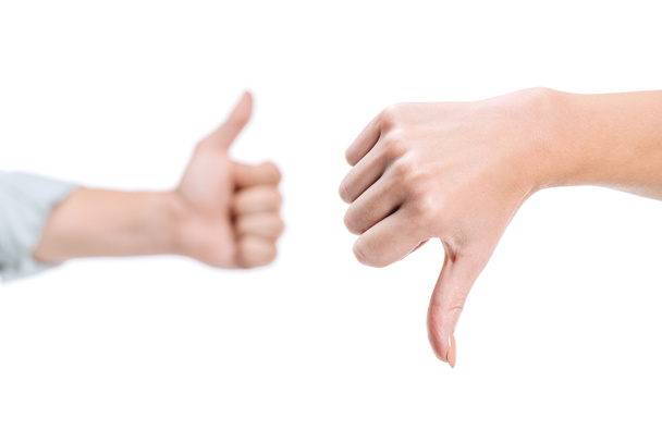 cropped image of woman and man showing thumb up and thumb down isolated on white - Fotografie, Obrázek