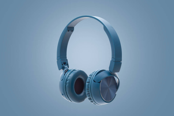 Bluetooth синій навушник на синьому фоні студійне обладнання для знімання
 - Фото, зображення