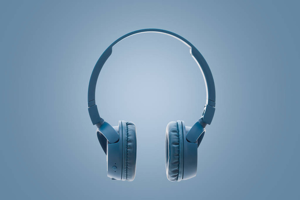 blauwe Bluetooth hoofdtelefoon op blauwe achtergrond Studioapparatuur pack shot - Foto, afbeelding