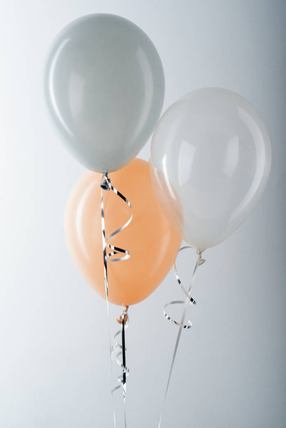 Balloons and metallic silver ribbon - Foto, imagen