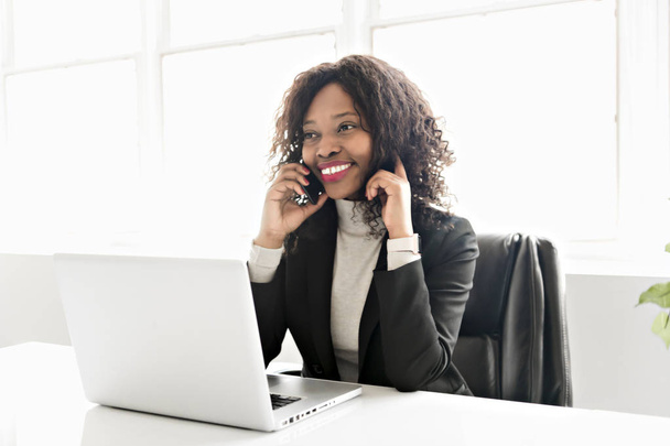 Beautiful black woman working on self employee office - Фото, изображение