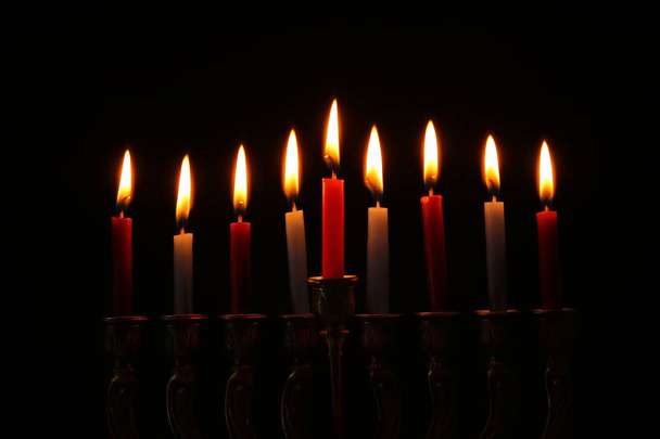 image of jewish holiday Hanukkah background with menorah (traditional candelabra) and candles. - Fotografie, Obrázek