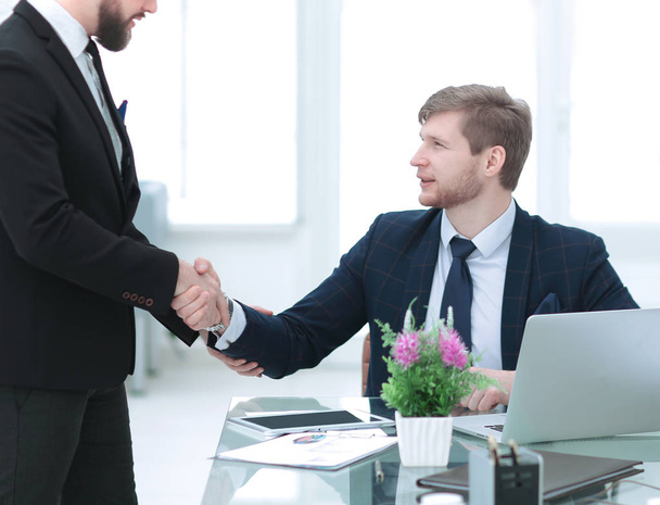 handshake Manager and employee in the workplace - Photo, image