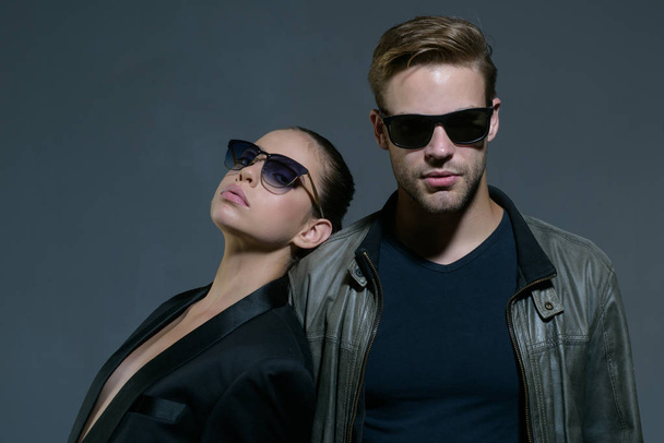 The best relationship. Friendship relations. Fashion models in trendy sun glasses. Couple in love. Couple of man and woman wear fashion glasses. Love relations. Friendship day. The closest friends - Фото, изображение