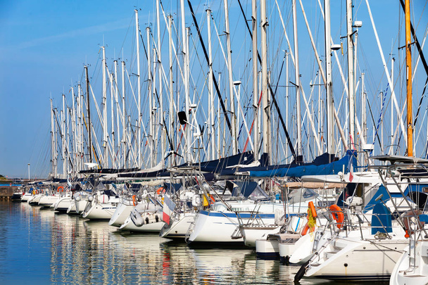 White sailing boats at harbour against clear blue sky - Photo, Image
