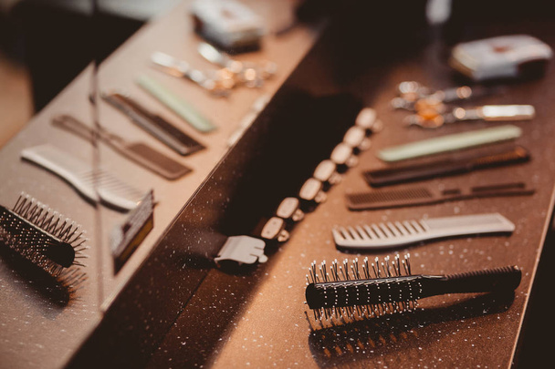 Hairdressers tools: combs, scissors, clip-on hair clipper - Fotoğraf, Görsel