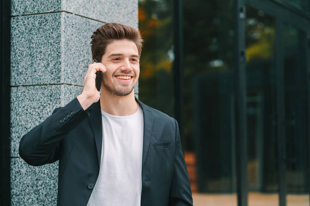 Close up portrait of businessman have conversation using mobile phone. Business guy in formal suit gladly talks with colleague. Office employee, wage worker, weekdays concept. - Фото, зображення