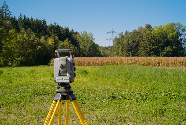 Surveying High Voltage Power Lines - Total Station in the Field - Photo, Image