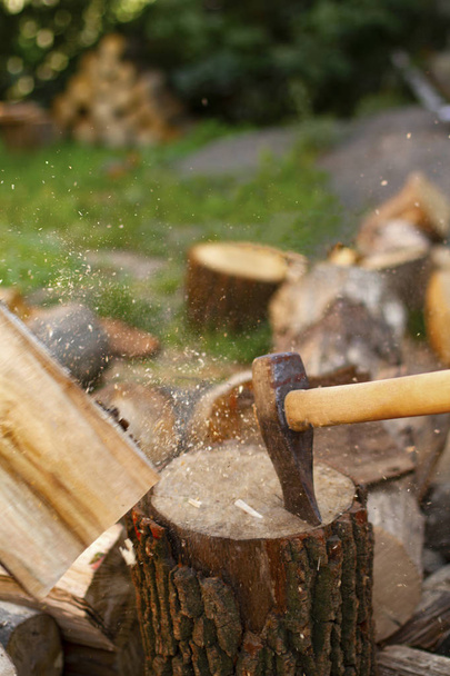 Ax in stump. Tool for work. Forester ax in the forest, chopping wood. Ax close up. - Φωτογραφία, εικόνα