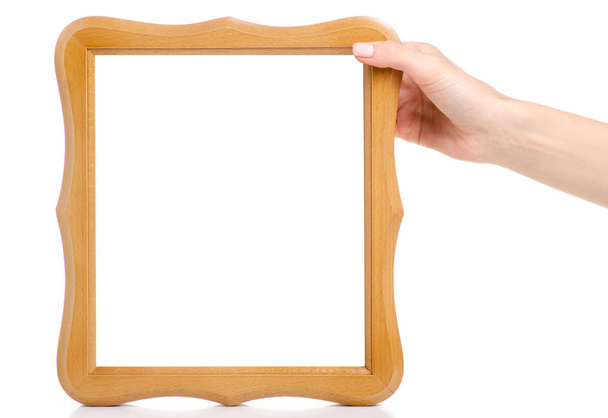 Wooden photo frame in hand - 写真・画像