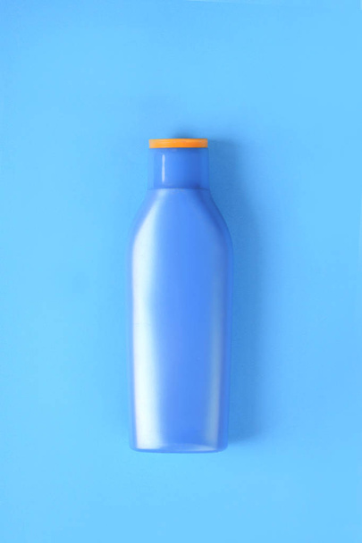 Close up view of empty sunscreen. Summer concept. Light blue white background - Photo, Image