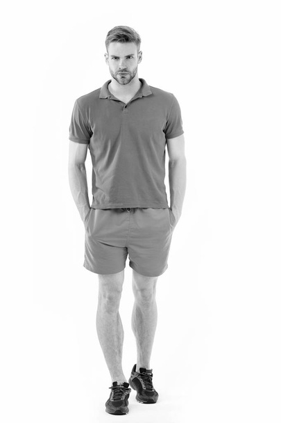 Man in active wear and sneakers isolated on white. Sportsman in full length. Fit and confident. Sport fashion and style. Training and workout activity. Personal trainer for healthy lifestyle. dieting. - Φωτογραφία, εικόνα