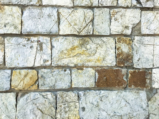 Textura, fundo, parede de grandes pedras naturais, não tratadas
 - Foto, Imagem