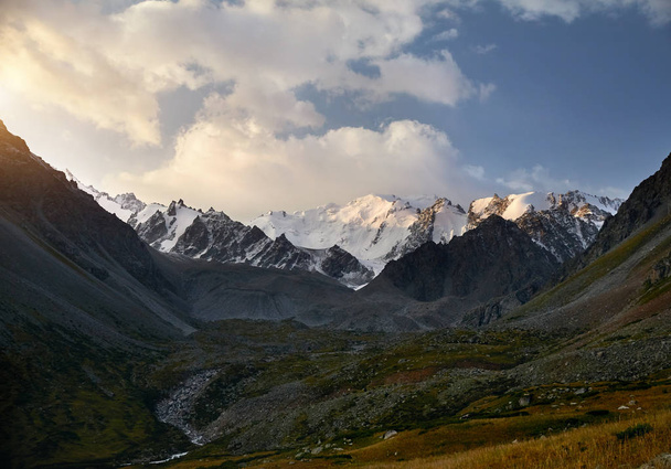 Beautiful landscape of snowy mountains in green valley of Left Talgar in Kazakhstan, Central Asia  - 写真・画像