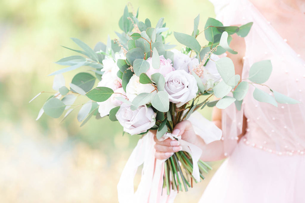 brides hands hold beautiful bridal bouquet outdoor - Photo, Image
