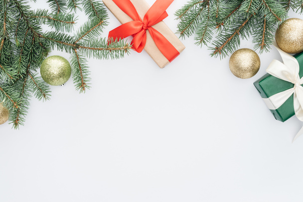 flat lay with arranged pine tree branches, gifts and christmas toys isolated on white - Φωτογραφία, εικόνα