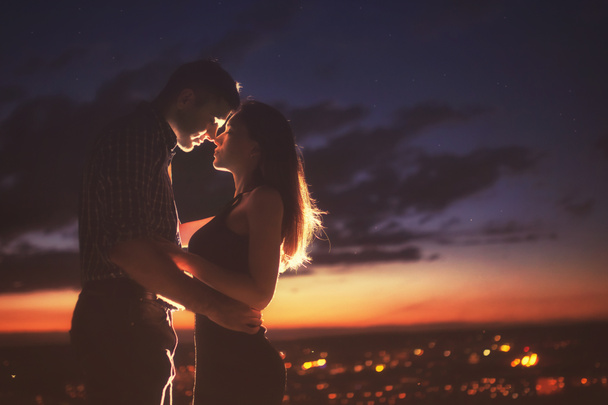 Lovers man and girl against background night city - Foto, Imagem