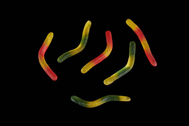 gummy jelly worm candy on a black background. - 写真・画像