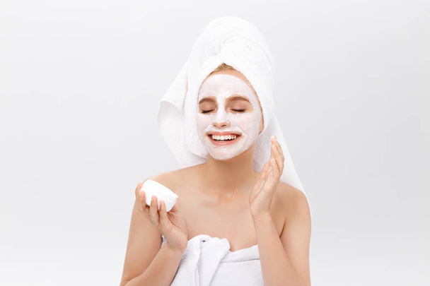 Beautiful woman with facial mask on white background. - Fotó, kép