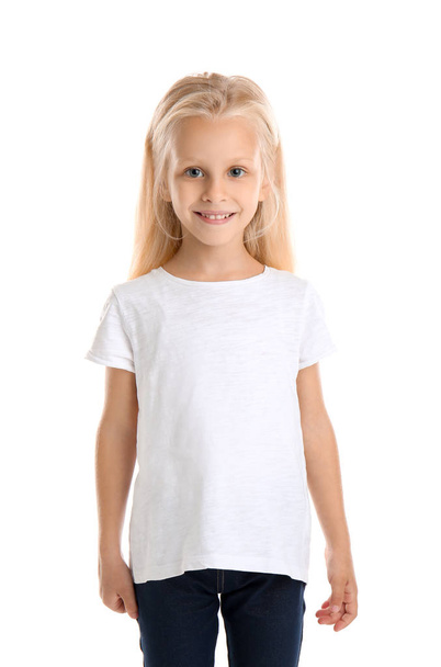Cute little girl in t-shirt on white background - Фото, изображение