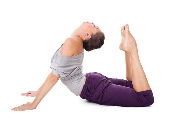 Young woman doing yoga exercise cobra pose - Valokuva, kuva