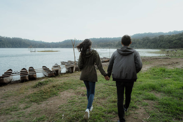 beautiful couple holding hand together  - Zdjęcie, obraz