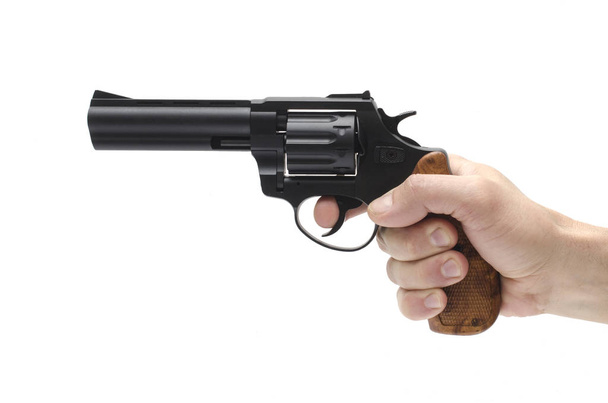 Revolver in der Hand auf weißem Hintergrund - Foto, Bild