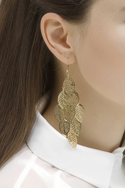 gold earring on the girl's ear - Photo, Image