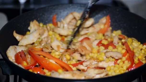 Stir fry chicken, sweet peppers and corn. - Footage, Video