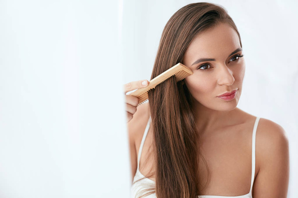 Hair Care. Woman Combing Beautiful Long Hair With Wooden Brush - Zdjęcie, obraz