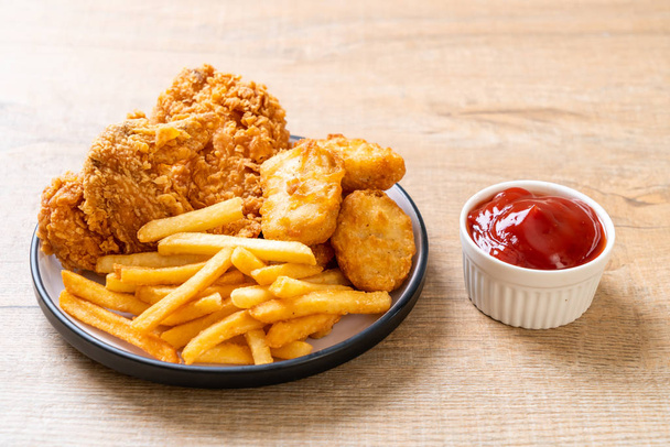 fried chicken with french fries and nuggets meal - junk food and unhealthy food - Fotografie, Obrázek