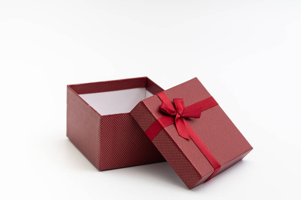 present box with color ribbon on white background for christmas birthday special occasion - Valokuva, kuva
