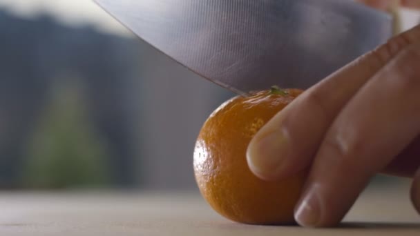 Cutting fresh spraying orange - Кадри, відео