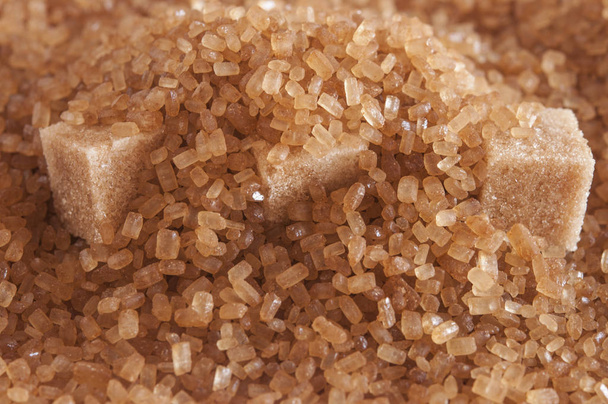 brown sugar cubes on powdered sugar - Photo, Image