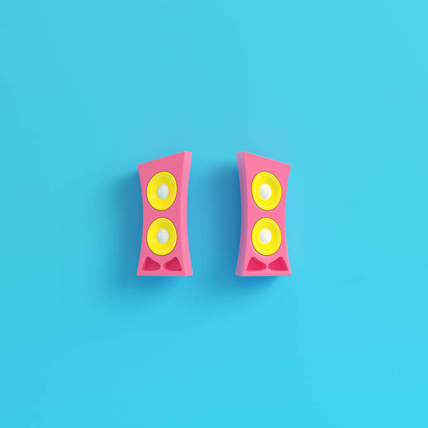 Pink cartoon-styled speaker on bright blue background in pastel colors. Minimalism concept. 3d render - 写真・画像