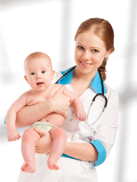 Pediatrician woman doctor holding patient baby - Foto, imagen