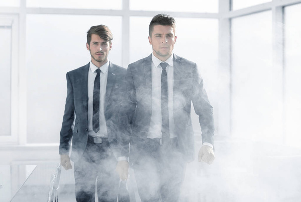 business people in a smoky office - Foto, Imagen