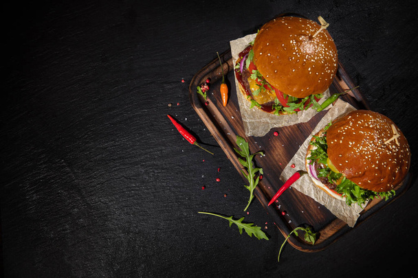 Delicious hamburgers, served on stone. Top view. Free space for text - Foto, immagini