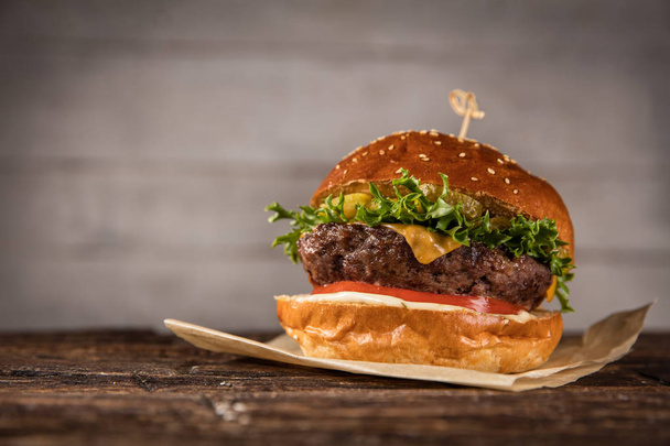 Delicious hamburger, served on wood. Free space for text - Foto, immagini