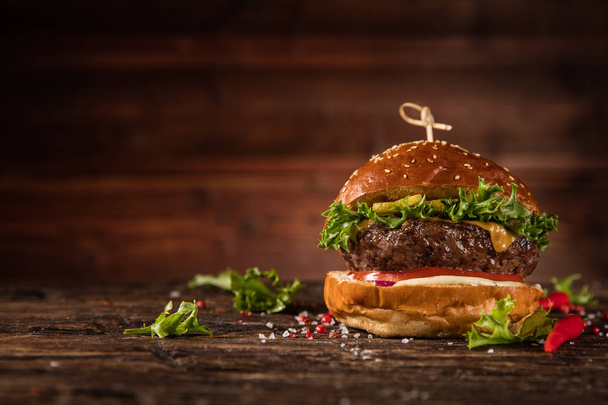 Delicious hamburger, served on wood. Free space for text - Fotografie, Obrázek