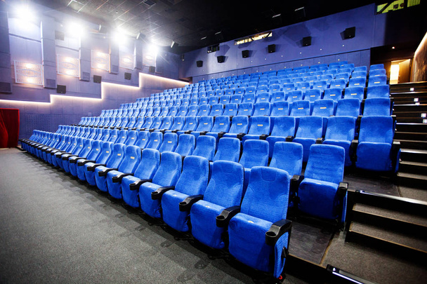 Empty comfortable red seats with numbers in cinema - Fotoğraf, Görsel